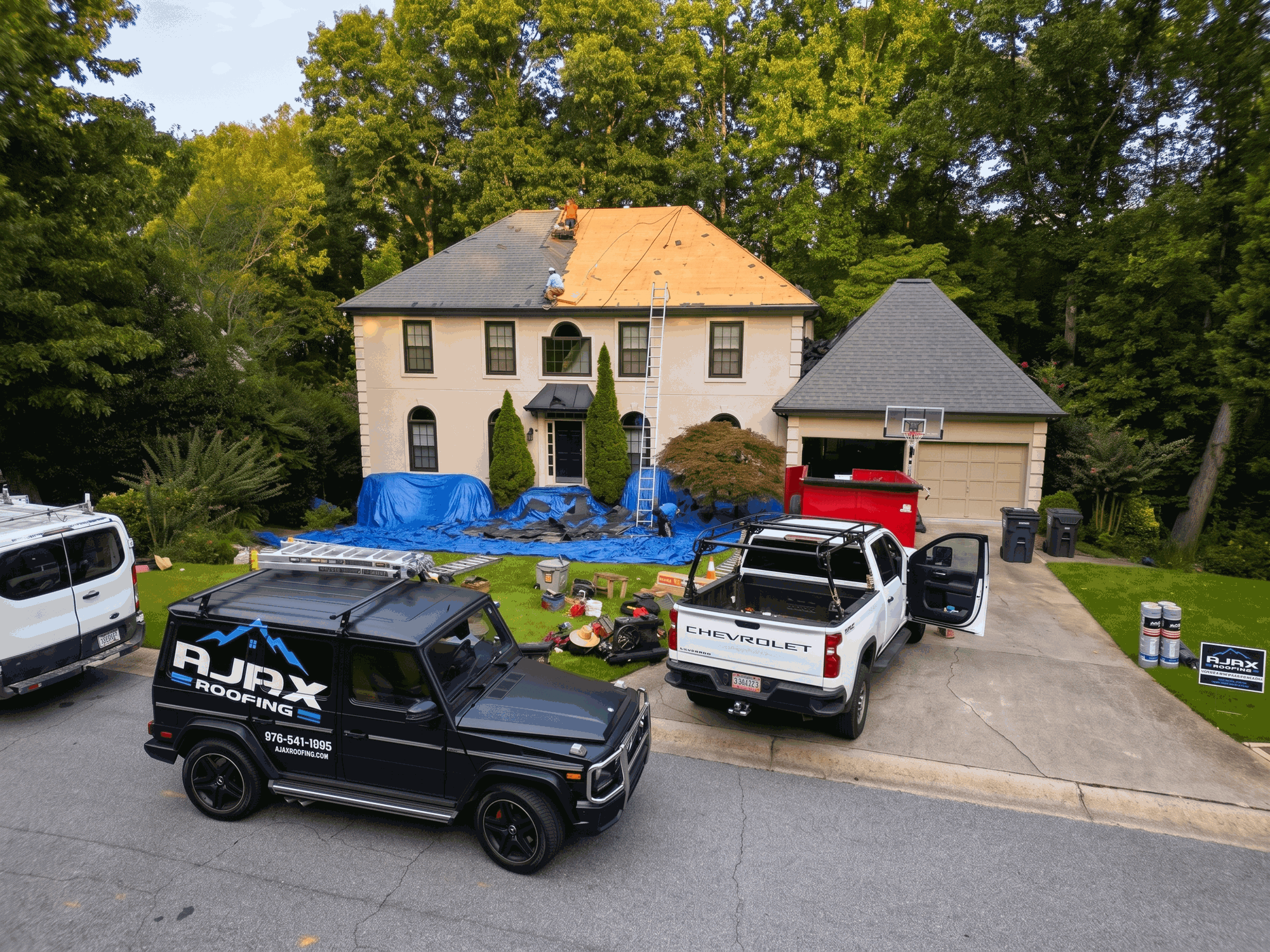 Ajax Roofing crew at work on a roof replacement